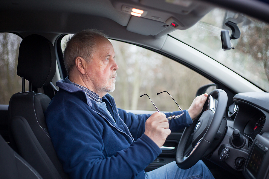 Senior man taking driving evaluation for seniors